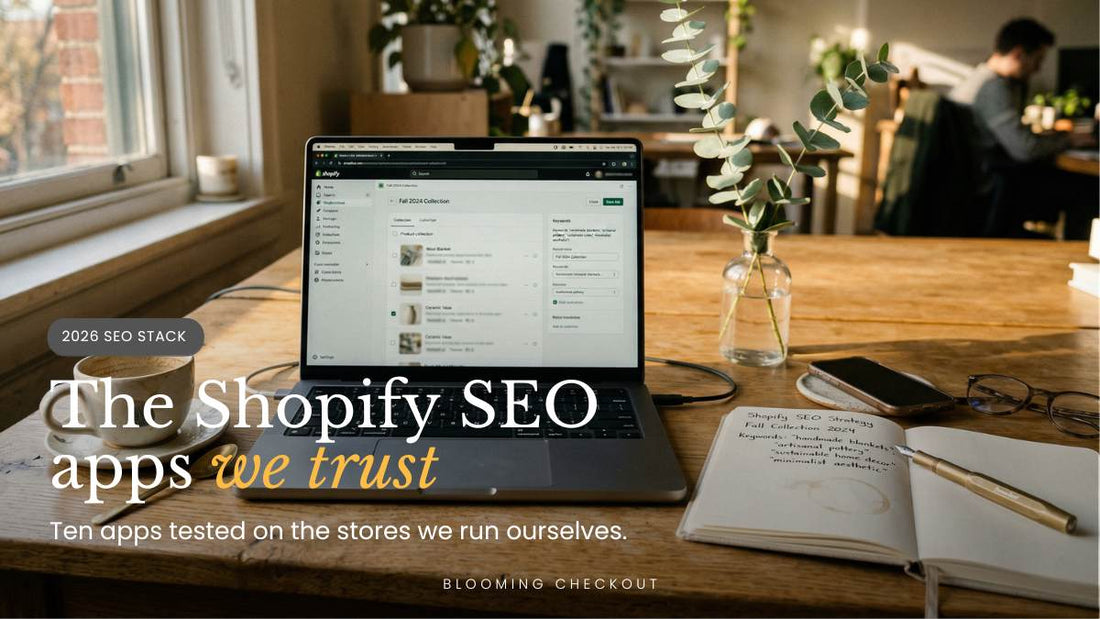 Laptop showing Shopify admin and a handwritten SEO notebook on a wooden desk, the Best SEO App for Shopify in 2026 stack.