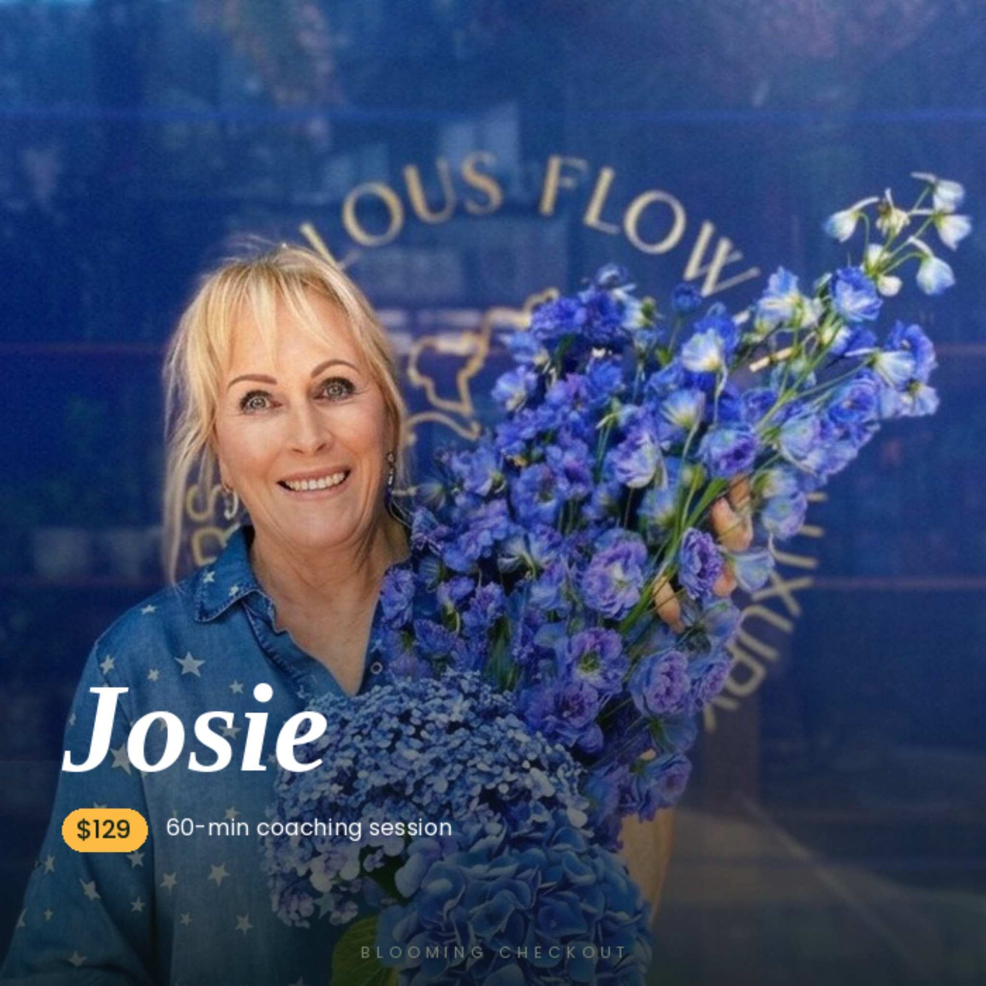 Florist holding blue flowers and smiliing, the name Josie on the card