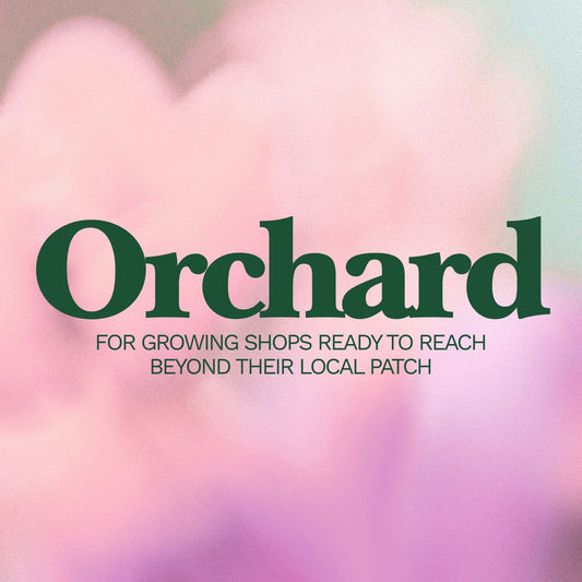 Promotional graphic for 'Orchard' with text on a blurred background