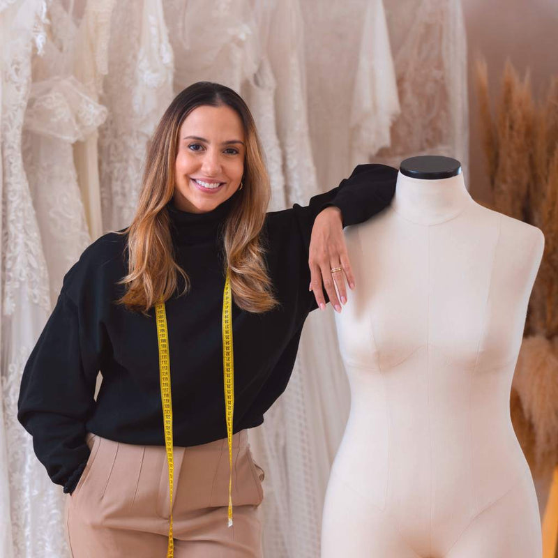 Woman browsing fashion in a boutique clothing store
